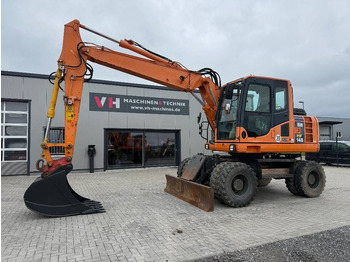 Escavadeira de rodas KOMATSU PW148-8