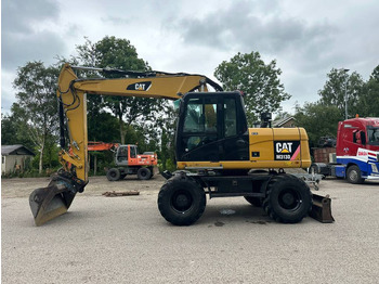 Escavadeira de rodas CATERPILLAR M313D