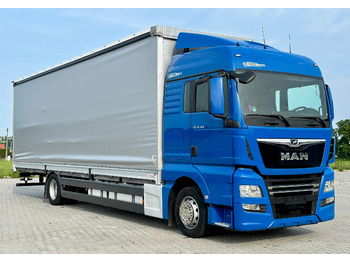 Caminhão com lona MAN TGX 18.360