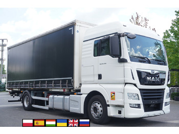 Caminhão com lona MAN TGX