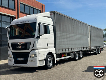 Caminhão com lona MAN TGX 26.480