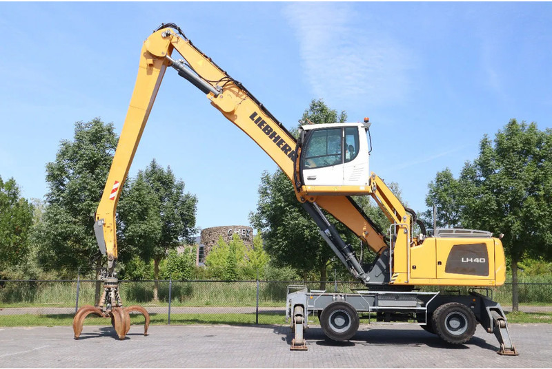 Liebherr LH 40 M LITRONIC | GRAB | QUICK COUPLER | 16 METER - Escavadeira de rodas: foto 1 Liebherr LH 40 M LITRONIC | GRAB | QUICK COUPLER | 16 METER - Escavadeira de rodas: foto 1
