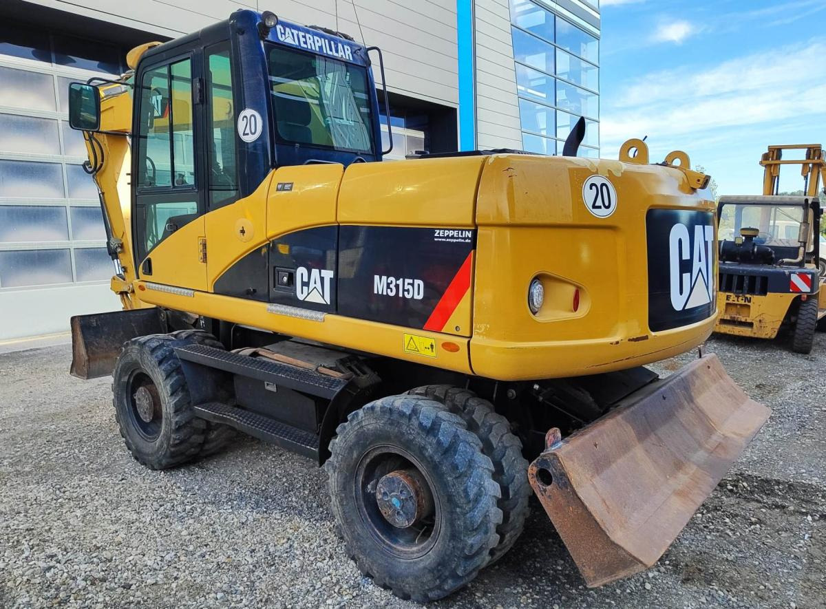 Caterpillar M315D - Escavadeira de rodas: foto 1 Caterpillar M315D - Escavadeira de rodas: foto 1