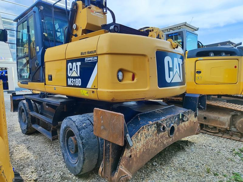 Caterpillar M318D MH - Escavadeira de rodas: foto 1 Caterpillar M318D MH - Escavadeira de rodas: foto 1