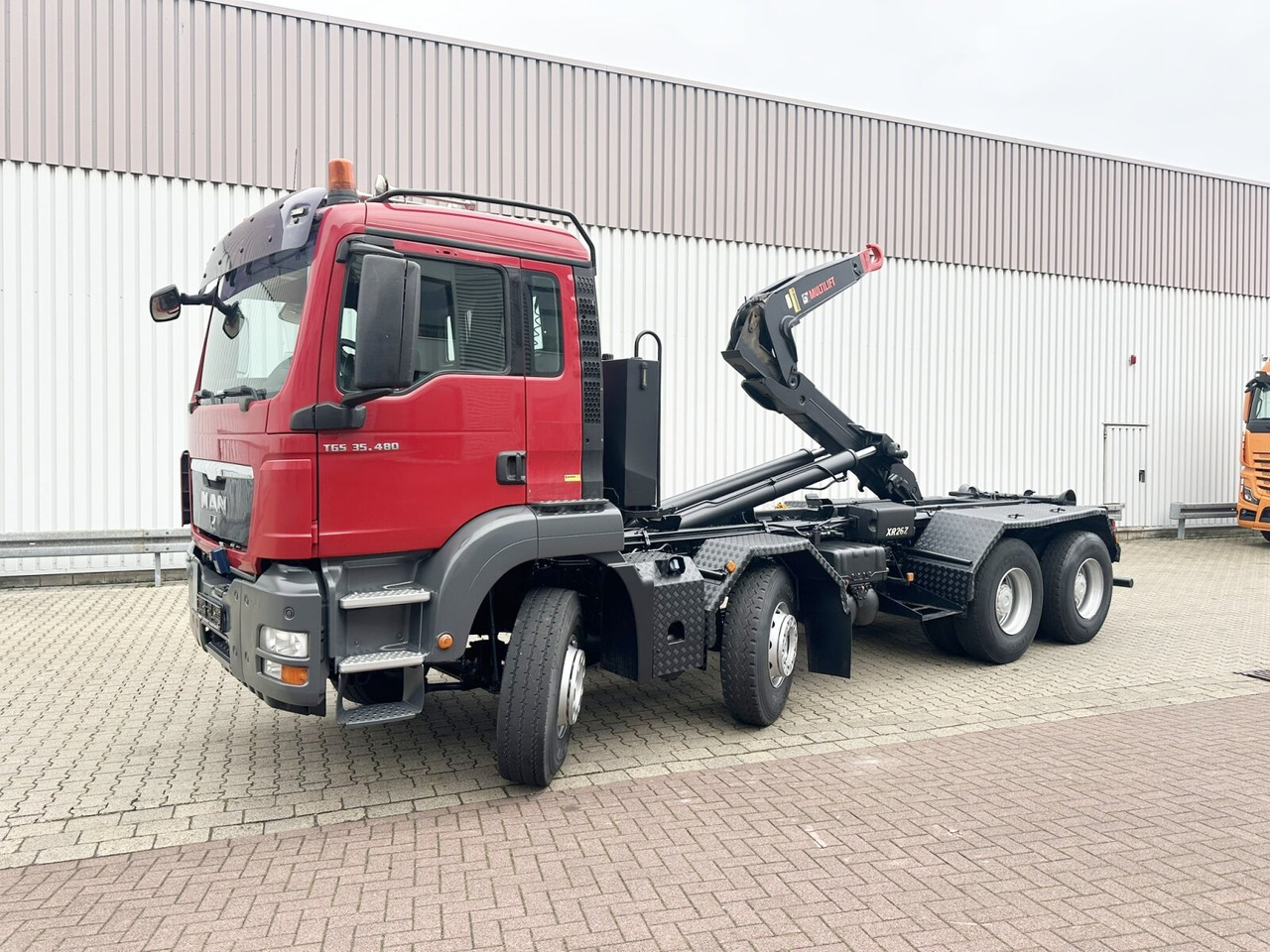 MAN TGS 35.480 8X4 BL TGS 35.400 8x4 BL, Schub-Knick bis 6,5m Container - Caminhão polibenne: foto 1 MAN TGS 35.480 8X4 BL TGS 35.400 8x4 BL, Schub-Knick bis 6,5m Container - Caminhão polibenne: foto 1