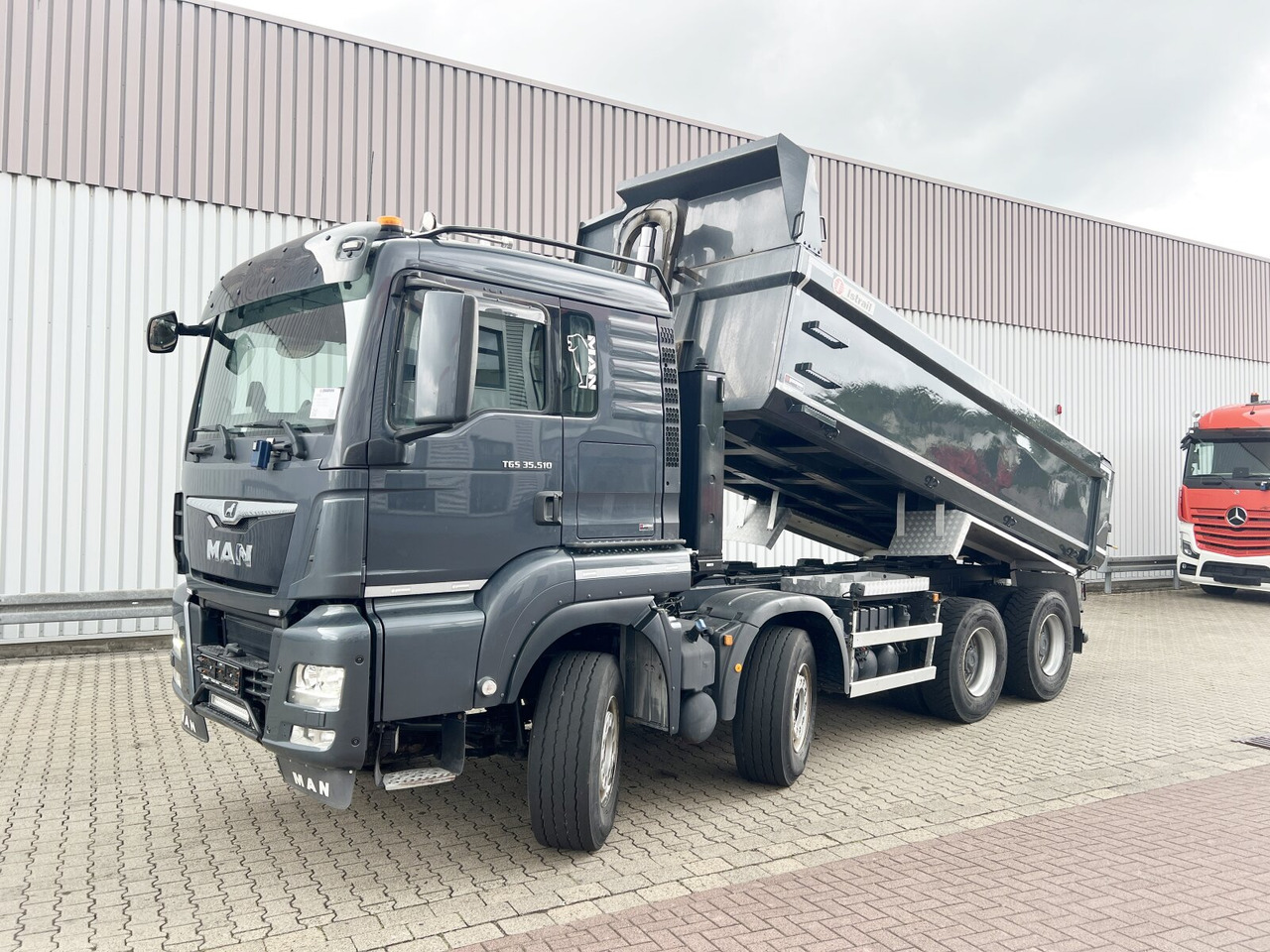 MAN TGS 35.510 8x4 BL TGS 35.510 8x4 BL, Intarder, Stahlmulde ca. 13m³, hydr. Heckklappenöffnung - Dumper: foto 1 MAN TGS 35.510 8x4 BL TGS 35.510 8x4 BL, Intarder, Stahlmulde ca. 13m³, hydr. Heckklappenöffnung - Dumper: foto 1