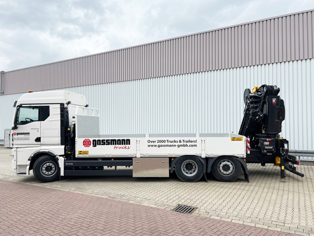 MAN TGX 26.510 6x2-4 LL CH TGX 26.510 6x2-4 LL, Kran Hiab X-HiPro 548 E-8, Lenk-/Liftachse, TwistLock 20Fuß, Funk, Retarder - Caminhão grua, Camião de caixa aberta/ Plataforma: foto 2 MAN TGX 26.510 6x2-4 LL CH TGX 26.510 6x2-4 LL, Kran Hiab X-HiPro 548 E-8, Lenk-/Liftachse, TwistLock 20Fuß, Funk, Retarder - Caminhão grua, Camião de caixa aberta/ Plataforma: foto 2