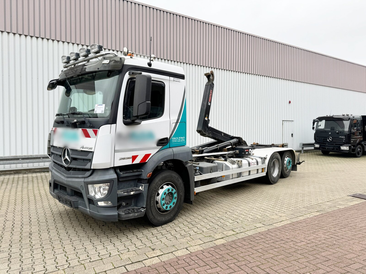Mercedes-Benz Antos 2536/43 L 6x2 Antos 2536/43 L 6x2, Liftachse, Hiab XR 21S61 bis 7 m Container - Caminhão polibenne: foto 1 Mercedes-Benz Antos 2536/43 L 6x2 Antos 2536/43 L 6x2, Liftachse, Hiab XR 21S61 bis 7 m Container - Caminhão polibenne: foto 1