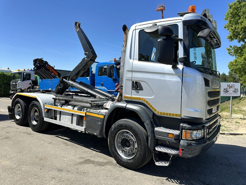 Scania G450 6x4 HOOKLIFT AJK 20T - 5760mm - 3m90 WB - HUB REDUCTION / STEEL SUSP. - EURO 6 - BE TRUCK - Caminhão polibenne: foto 1 Scania G450 6x4 HOOKLIFT AJK 20T - 5760mm - 3m90 WB - HUB REDUCTION / STEEL SUSP. - EURO 6 - BE TRUCK - Caminhão polibenne: foto 1