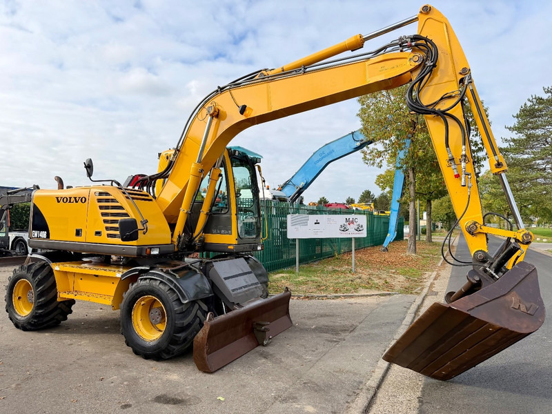 Volvo EW 140 B *FULL HYDR* - BLADE - 10.485h - TILT BUCKET - CE - NL MACHINE - GOOD CONDITION - Escavadeira de rodas: foto 1 Volvo EW 140 B *FULL HYDR* - BLADE - 10.485h - TILT BUCKET - CE - NL MACHINE - GOOD CONDITION - Escavadeira de rodas: foto 1