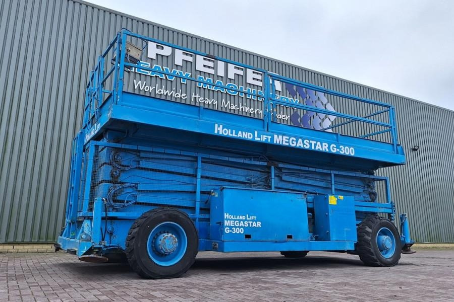 Holland Lift Megastar G300 Diesel, 4x4x4 Drive, 33.5m Working H - Plataforma de Tijera/ Plataforma de tesoura: foto 1 Holland Lift Megastar G300 Diesel, 4x4x4 Drive, 33.5m Working H - Plataforma de Tijera/ Plataforma de tesoura: foto 1