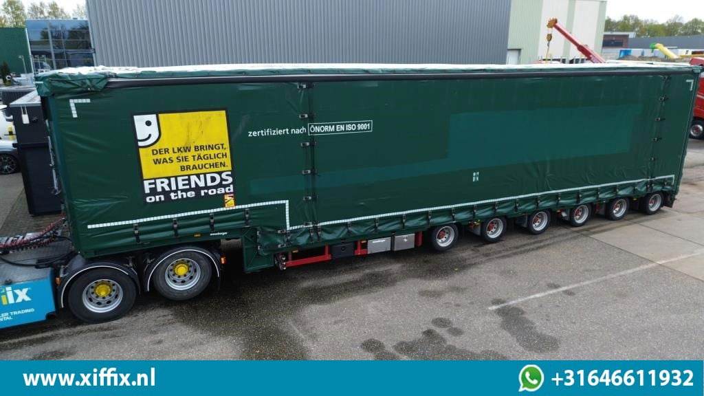 Meusburger 6-ass. Semi dieplader met elektrische huifopbouw / 3x naloop gestuurd - Semireboque baixa: foto 1 Meusburger 6-ass. Semi dieplader met elektrische huifopbouw / 3x naloop gestuurd - Semireboque baixa: foto 1
