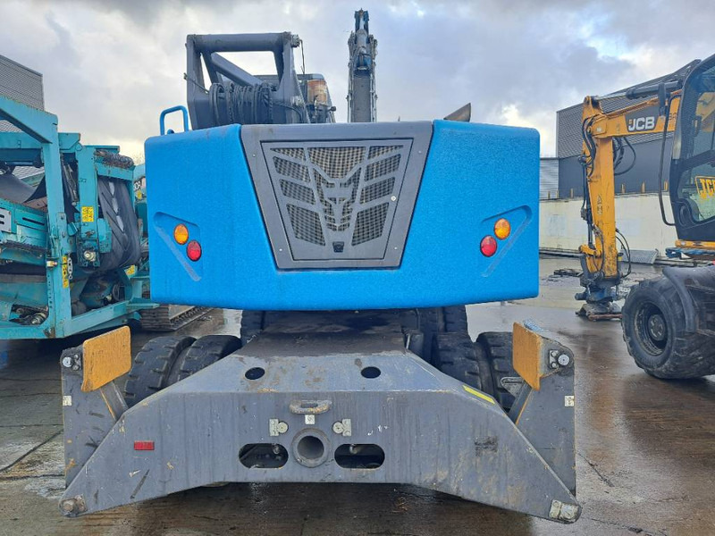 Manipulador de material para transporte de lixo Fuchs MHL 310: foto 7