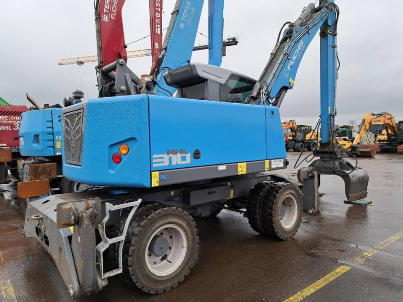 Fuchs MHL 310 - Manipulador de material: foto 1 Fuchs MHL 310 - Manipulador de material: foto 1