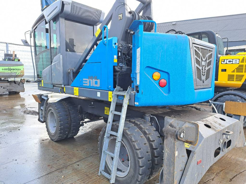 Manipulador de material para transporte de lixo Fuchs MHL 310: foto 6