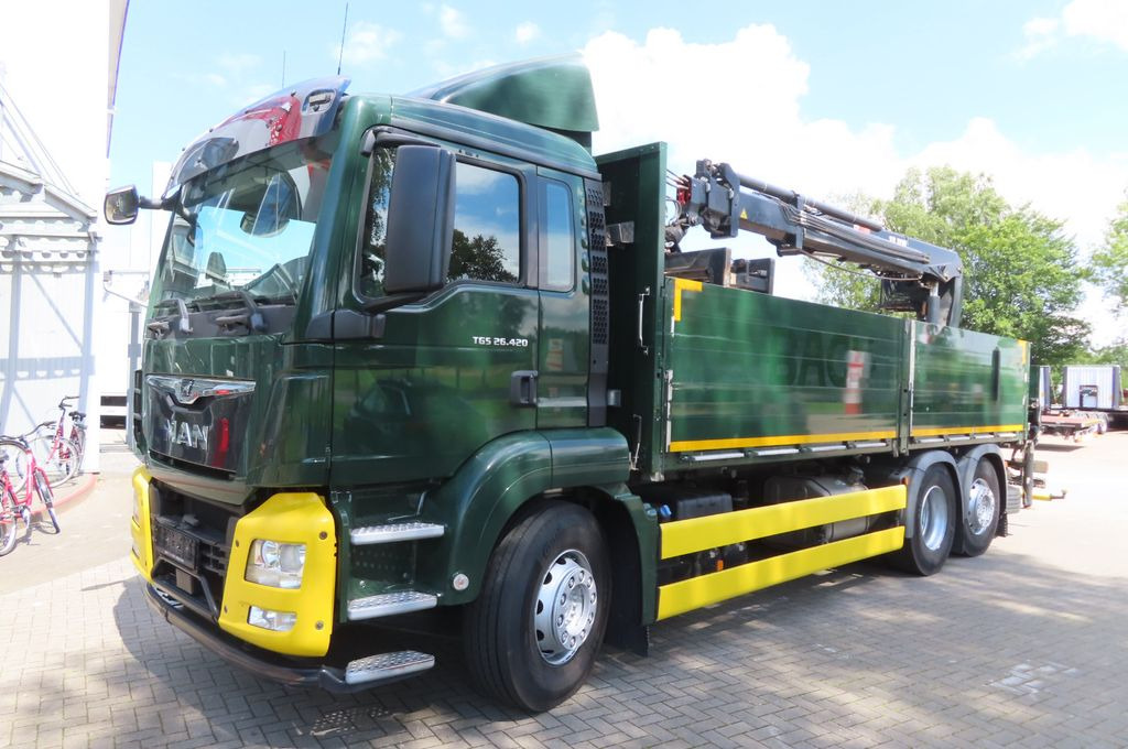 MAN TGX 26.500 6x2 - Baustoff - HIAB Kran - Camião de caixa aberta/ Plataforma, Caminhão grua: foto 1 MAN TGX 26.500 6x2 - Baustoff - HIAB Kran - Camião de caixa aberta/ Plataforma, Caminhão grua: foto 1