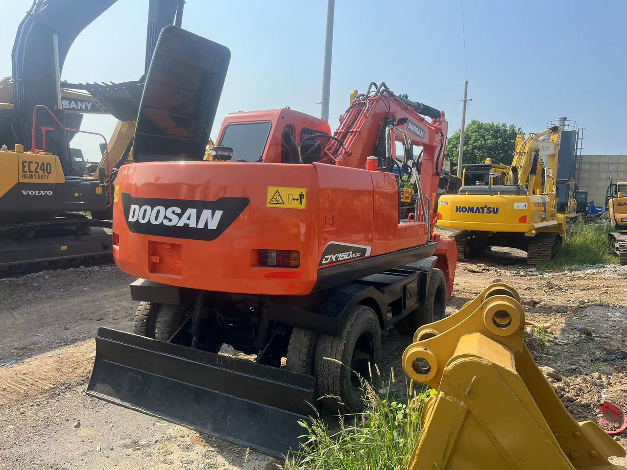 Doosan DX150W-9C - Escavadeira de rodas: foto 2 Doosan DX150W-9C - Escavadeira de rodas: foto 2