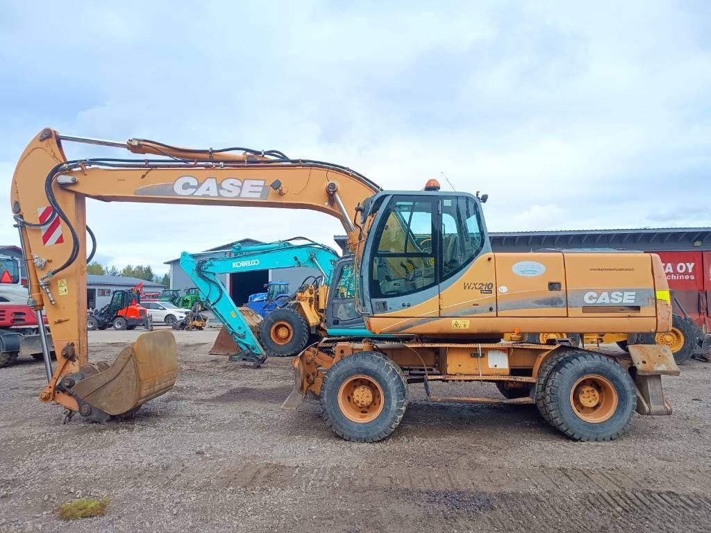 Case WX210 PYÖRITTÄJÄLLÄ - Escavadeira de rodas: foto 1 Case WX210 PYÖRITTÄJÄLLÄ - Escavadeira de rodas: foto 1