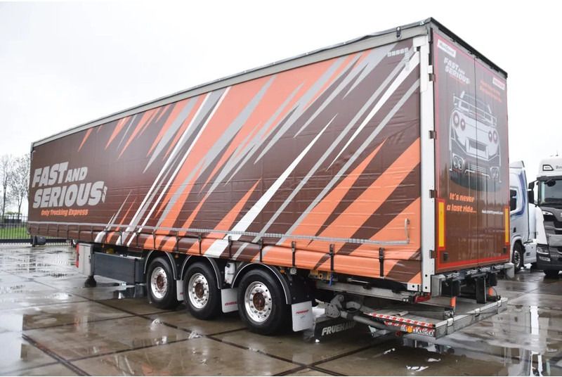 Fruehauf SLIDING CURTAINS/ROOF - TOPLIFT SYSTEM - LIFT AXLE - STEERING AXLE - SAF AXLES - ALCOA'S - DHOLLANDIA - TOP CONDITION - - Semi-reboque de lona: foto 4 Fruehauf SLIDING CURTAINS/ROOF - TOPLIFT SYSTEM - LIFT AXLE - STEERING AXLE - SAF AXLES - ALCOA'S - DHOLLANDIA - TOP CONDITION - - Semi-reboque de lona: foto 4