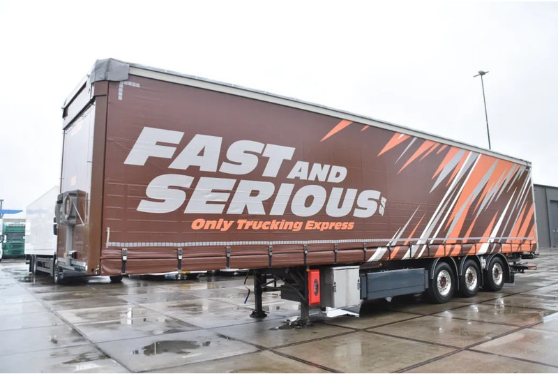 Fruehauf SLIDING CURTAINS/ROOF - TOPLIFT SYSTEM - LIFT AXLE - STEERING AXLE - SAF AXLES - ALCOA'S - DHOLLANDIA - TOP CONDITION - - Semi-reboque de lona: foto 5 Fruehauf SLIDING CURTAINS/ROOF - TOPLIFT SYSTEM - LIFT AXLE - STEERING AXLE - SAF AXLES - ALCOA'S - DHOLLANDIA - TOP CONDITION - - Semi-reboque de lona: foto 5
