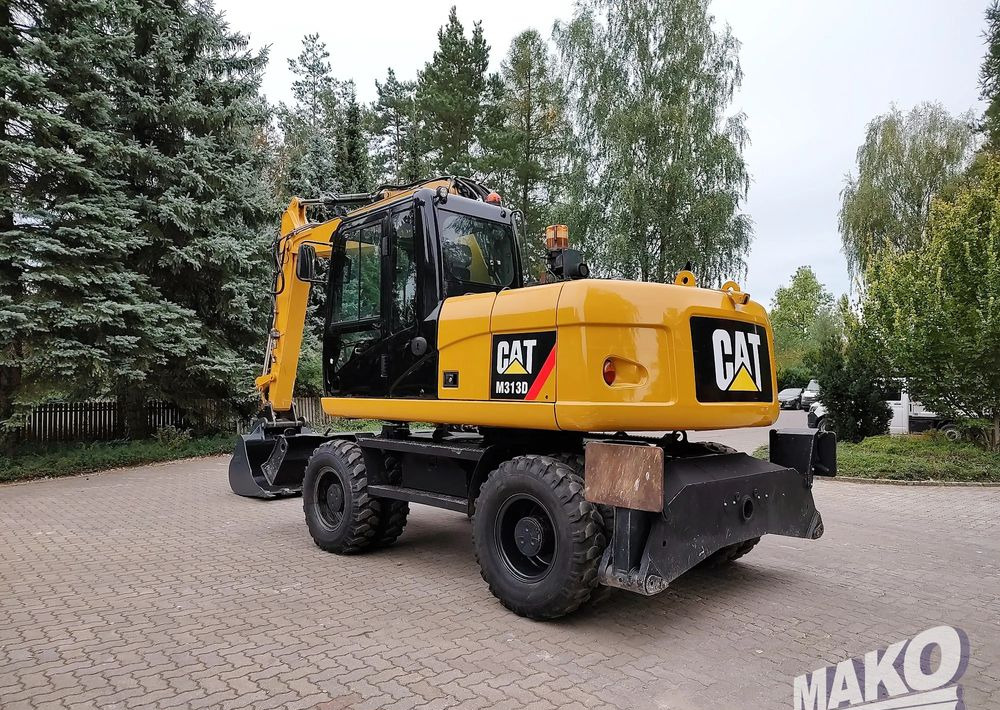 Caterpillar M313D - Escavadeira de rodas: foto 2 Caterpillar M313D - Escavadeira de rodas: foto 2