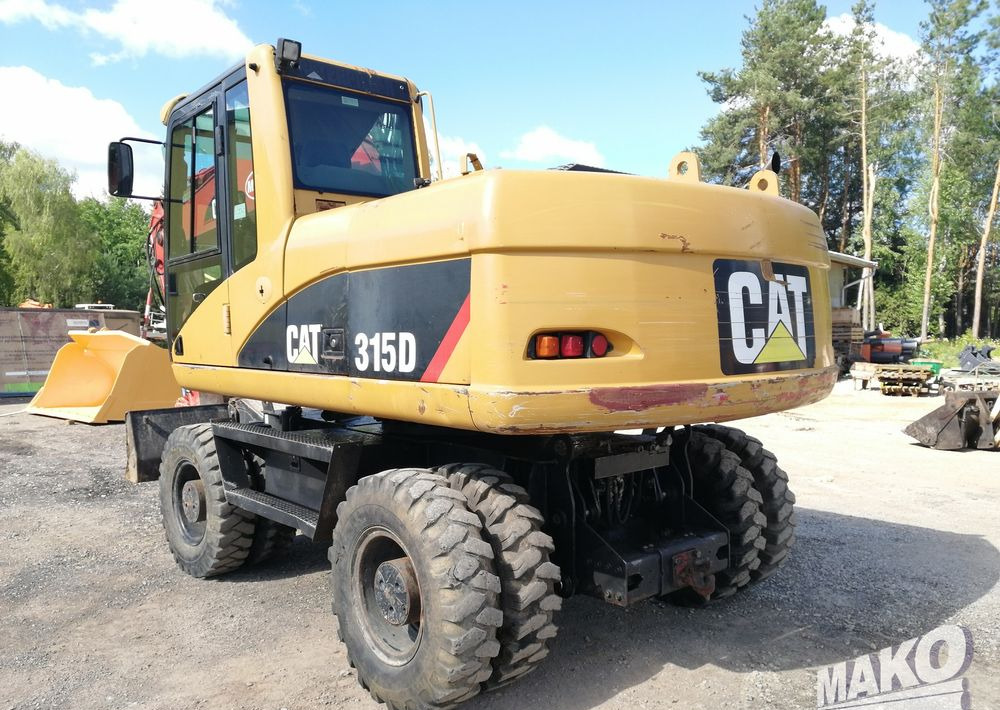 Caterpillar M315 C - Escavadeira de rodas: foto 3 Caterpillar M315 C - Escavadeira de rodas: foto 3