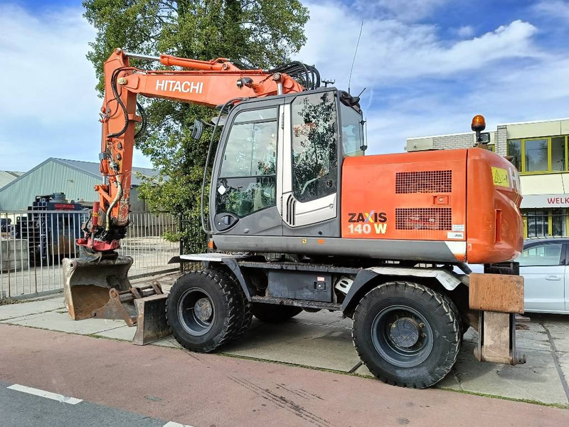 Hitachi ZX 140 W-3 mobiele graafmachine mobile excavator - Escavadeira de rodas: foto 1 Hitachi ZX 140 W-3 mobiele graafmachine mobile excavator - Escavadeira de rodas: foto 1