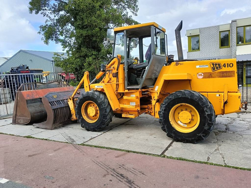 JCB 410 shovel wiellader loader + 2 bakken 4x4 robuust - Carregadeira de rodas: foto 1 JCB 410 shovel wiellader loader + 2 bakken 4x4 robuust - Carregadeira de rodas: foto 1