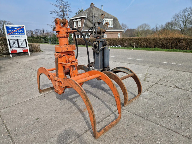 O & K en Atlas hydraulische bomenklemmen - Garra de Equipamento florestal: foto 1 O & K en Atlas hydraulische bomenklemmen - Garra de Equipamento florestal: foto 1