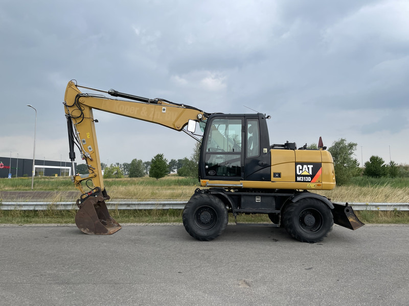 Caterpillar M313D - CE - Escavadeira de rodas: foto 2 Caterpillar M313D - CE - Escavadeira de rodas: foto 2