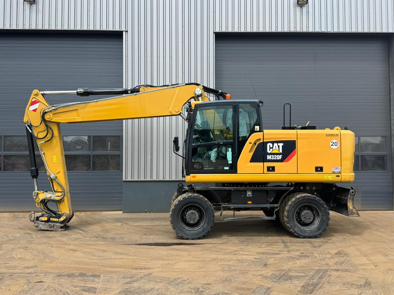 Caterpillar M320F - Escavadeira de rodas: foto 1 Caterpillar M320F - Escavadeira de rodas: foto 1