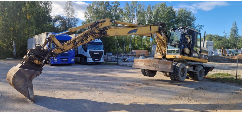 Caterpillar M 315 Rototilt - Escavadeira de rodas: foto 4 Caterpillar M 315 Rototilt - Escavadeira de rodas: foto 4