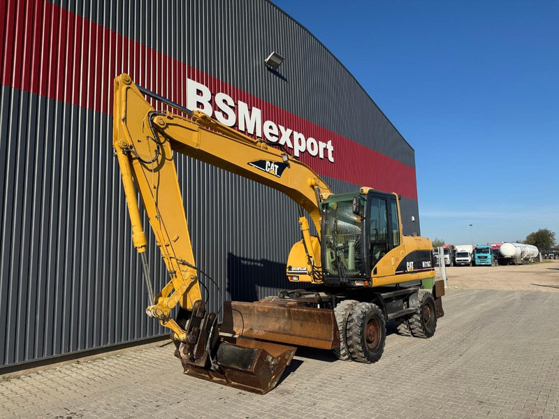 Caterpillar M 316 C - Escavadeira de rodas: foto 1 Caterpillar M 316 C - Escavadeira de rodas: foto 1