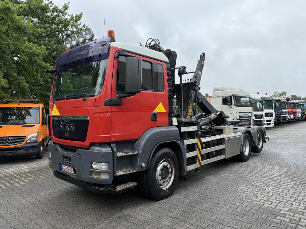 MAN TGS 26.360 6X2 Haken mit Kran HMF 1643Z - Caminhão polibenne, Caminhão grua: foto 1 MAN TGS 26.360 6X2 Haken mit Kran HMF 1643Z - Caminhão polibenne, Caminhão grua: foto 1