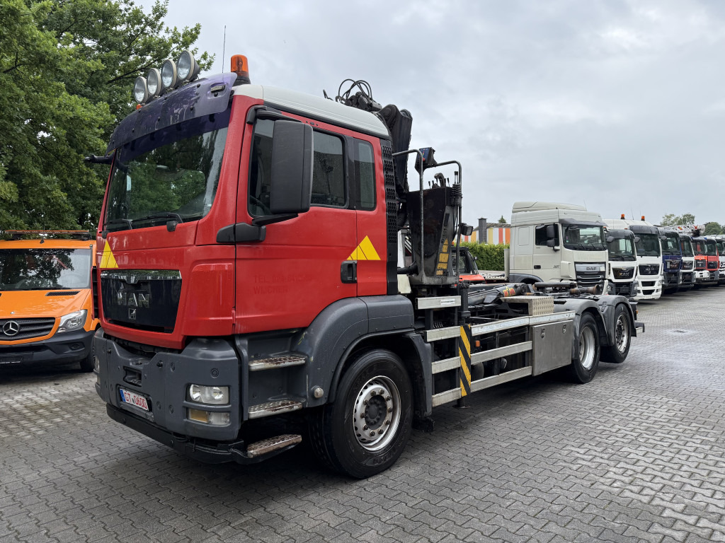 MAN TGS 26.360 6X2 Haken mit Kran HMF 1643Z - Caminhão polibenne, Caminhão grua: foto 1 MAN TGS 26.360 6X2 Haken mit Kran HMF 1643Z - Caminhão polibenne, Caminhão grua: foto 1