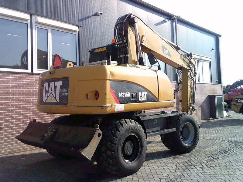 Caterpillar M315D - Escavadeira de rodas: foto 3 Caterpillar M315D - Escavadeira de rodas: foto 3