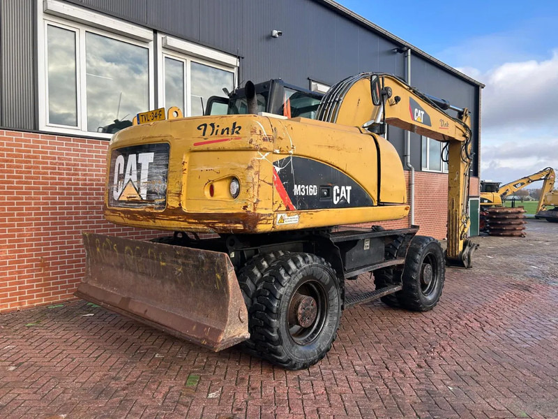 Caterpillar M316D - Escavadeira de rodas: foto 2 Caterpillar M316D - Escavadeira de rodas: foto 2