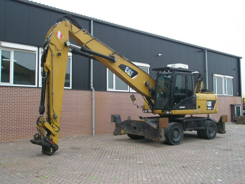 Caterpillar M318D - Escavadeira de rodas: foto 1 Caterpillar M318D - Escavadeira de rodas: foto 1