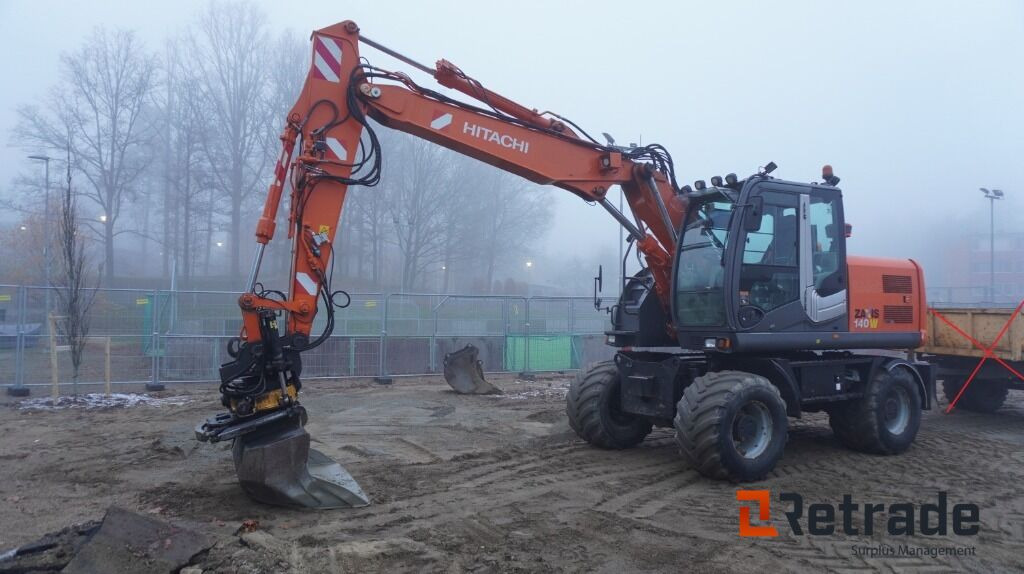 Hjulgrävare Hitachi ZX 140W-3 - Escavadeira de rodas: foto 1 Hjulgrävare Hitachi ZX 140W-3 - Escavadeira de rodas: foto 1