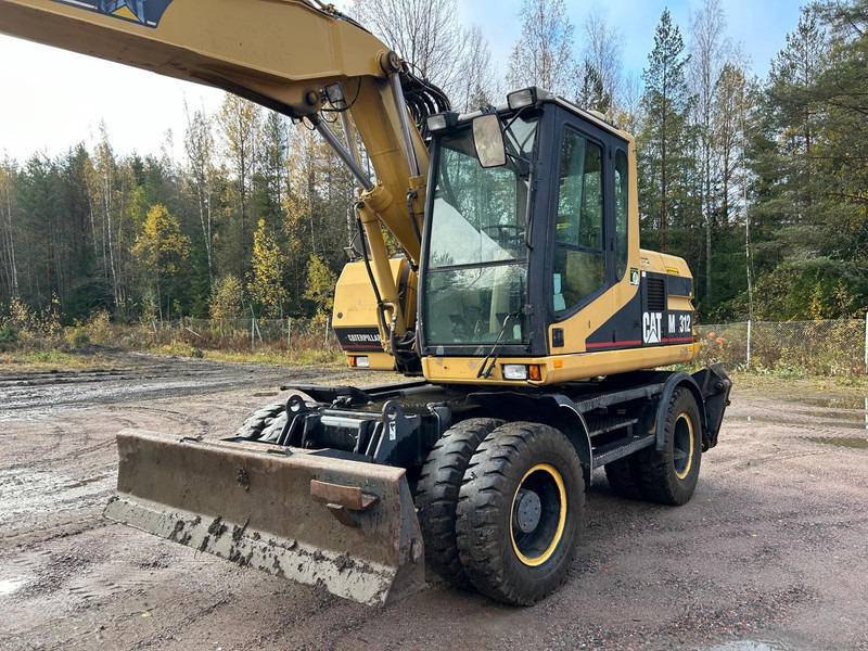 Caterpillar M312 Engcon EC20 tiltrotator - Escavadeira de rodas: foto 2 Caterpillar M312 Engcon EC20 tiltrotator - Escavadeira de rodas: foto 2