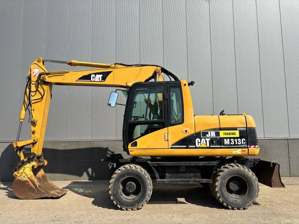 CAT M 313 C (Low verified hours) - Escavadeira de rodas: foto 1 CAT M 313 C (Low verified hours) - Escavadeira de rodas: foto 1