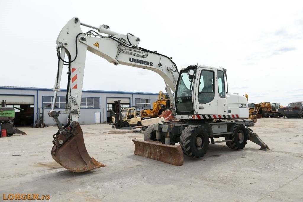 Liebherr A 316 Litronic - Escavadeira de rodas: foto 5 Liebherr A 316 Litronic - Escavadeira de rodas: foto 5