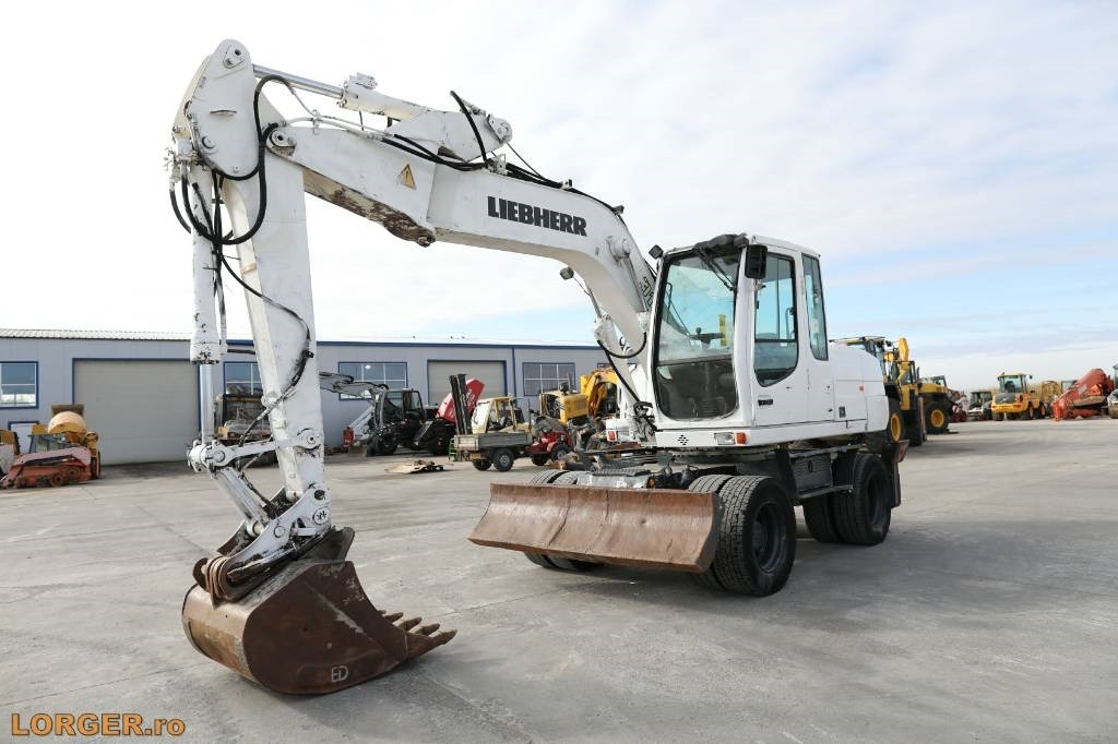 Liebherr A 316 Litronic - Escavadeira de rodas: foto 1 Liebherr A 316 Litronic - Escavadeira de rodas: foto 1