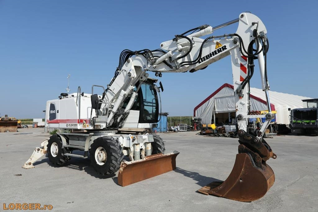 Liebherr A 914 - Escavadeira de rodas: foto 1 Liebherr A 914 - Escavadeira de rodas: foto 1