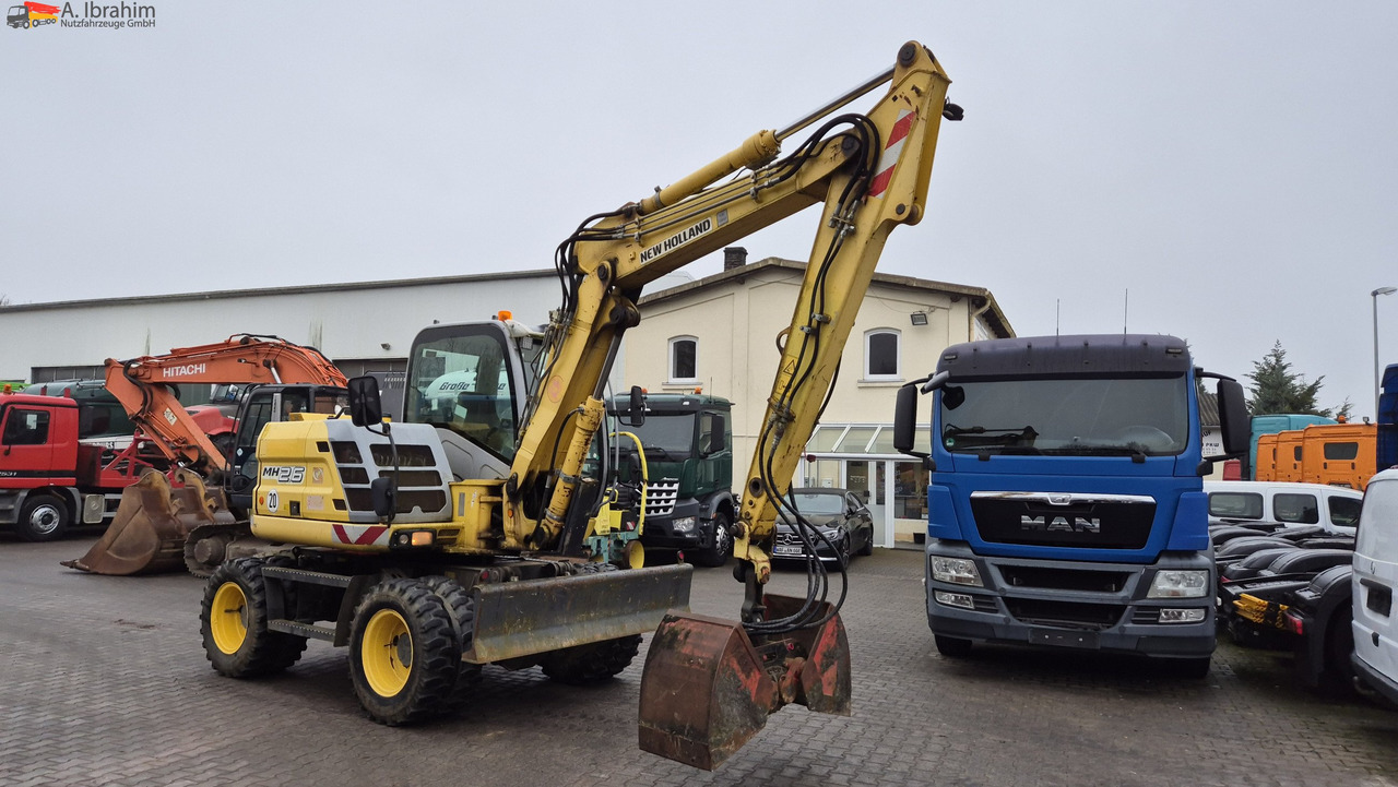 Escavadeira de rodas New Holland MH 2.6 Zustand gut, deutsche Maschine incl. Greifer und Dreservo: foto 6 Escavadeira de rodas New Holland MH 2.6 Zustand gut, deutsche Maschine incl. Greifer und Dreservo: foto 6