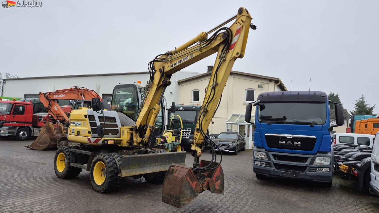 Escavadeira de rodas New Holland MH 2.6 Zustand gut, deutsche Maschine incl. Greifer und Dreservo: foto 9 Escavadeira de rodas New Holland MH 2.6 Zustand gut, deutsche Maschine incl. Greifer und Dreservo: foto 9