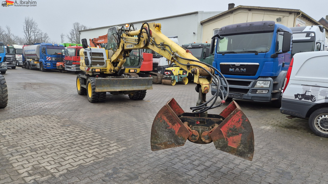 Escavadeira de rodas New Holland MH 2.6 Zustand gut, deutsche Maschine incl. Greifer und Dreservo: foto 13 Escavadeira de rodas New Holland MH 2.6 Zustand gut, deutsche Maschine incl. Greifer und Dreservo: foto 13