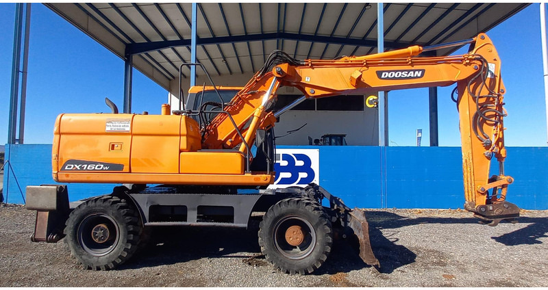 Doosan DX140W-3 - Escavadeira de rodas: foto 2 Doosan DX140W-3 - Escavadeira de rodas: foto 2