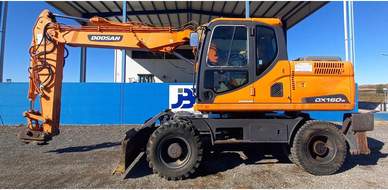 Doosan DX140W-3 - Escavadeira de rodas: foto 1 Doosan DX140W-3 - Escavadeira de rodas: foto 1