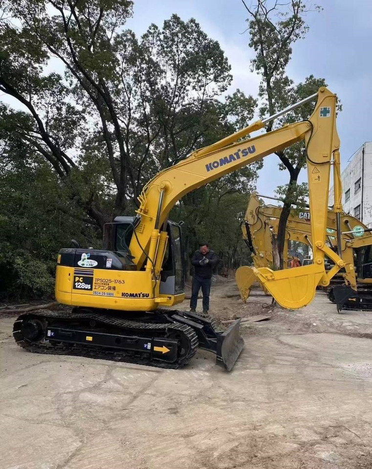 Komatsu 128 US - Escavadora de rastos: foto 1 Komatsu 128 US - Escavadora de rastos: foto 1